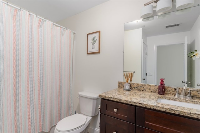 full bath with visible vents, vanity, and toilet