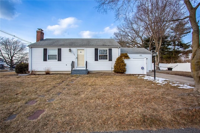 ranch-style house featuring a garage, entry steps, a chimney, fence, and a front lawn