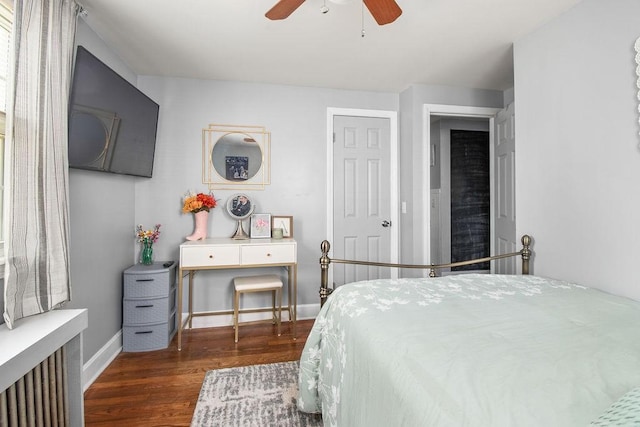 bedroom featuring ceiling fan, wood finished floors, and baseboards