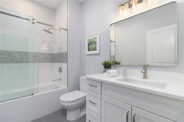 full bath with toilet, tile patterned flooring, bath / shower combo with glass door, and vanity