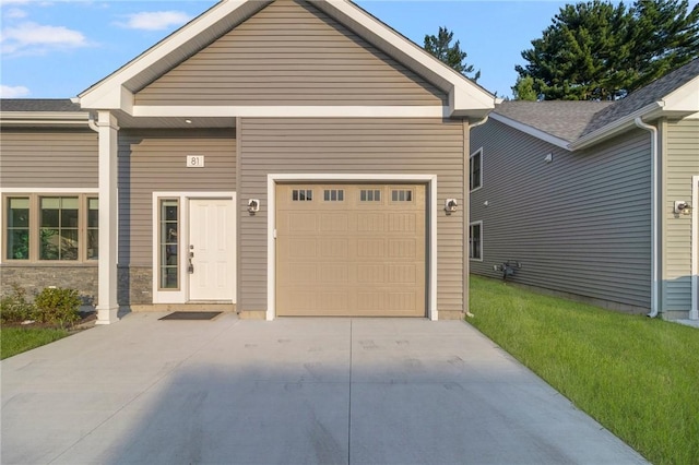 view of front of home featuring an attached garage and concrete driveway