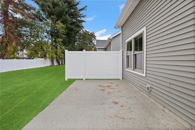 view of yard with fence and a patio