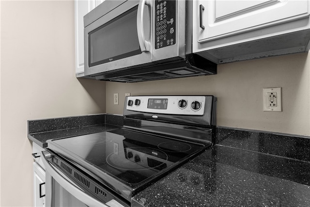 1000 Providence Pl Unit 106, Providence, RI 02903 - kitchen with white cabinets, stainless steel appliances, and dark countertops
