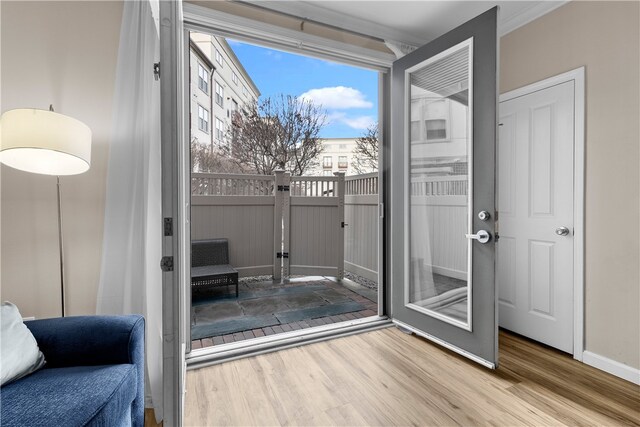 1000 Providence Pl Unit 106, Providence, RI 02903 - doorway to outside featuring baseboards, plenty of natural light, ornamental molding, and wood finished floors