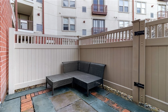 1000 Providence Pl Unit 106, Providence, RI 02903 - view of patio / terrace with an outdoor living space and fence