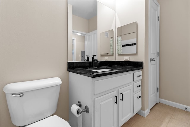 1000 Providence Pl Unit 106, Providence, RI 02903 - bathroom featuring vanity, baseboards, toilet, and tile patterned flooring