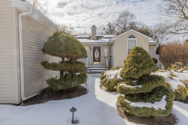 view of front of home with a chimney