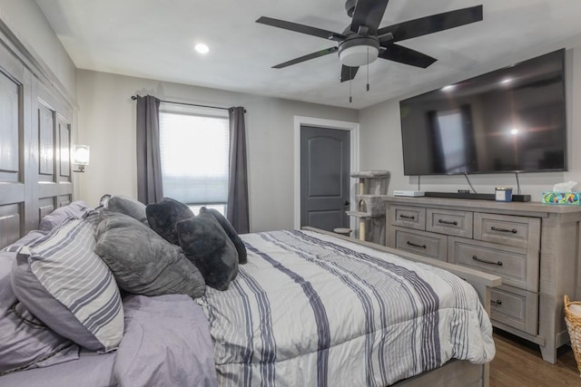 bedroom with wood finished floors and a ceiling fan