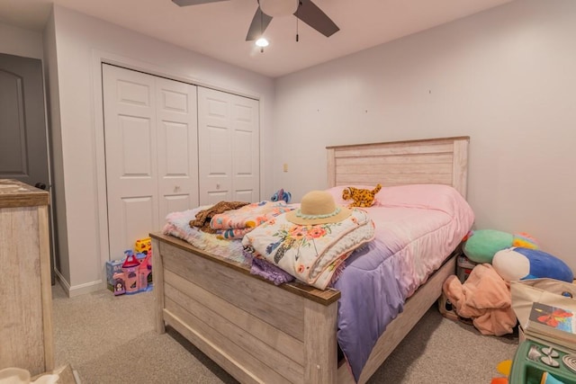 bedroom with a closet, carpet flooring, and ceiling fan