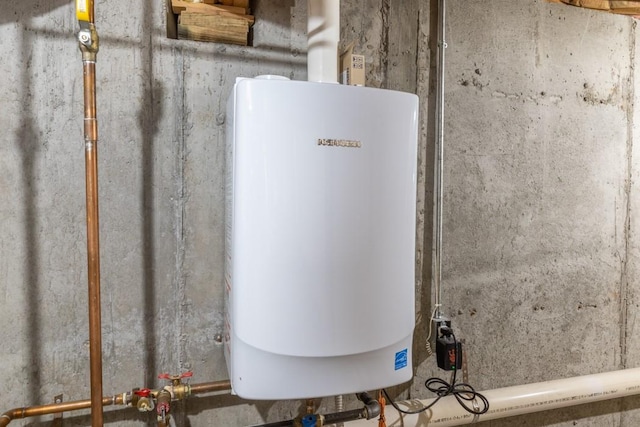 utility room featuring water heater