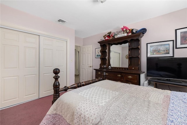 bedroom featuring a closet, carpet, and visible vents