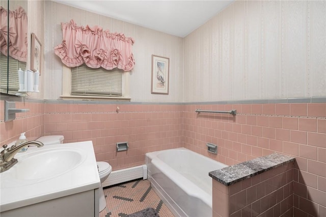 bathroom featuring wallpapered walls, toilet, a baseboard radiator, tile patterned flooring, and a bath