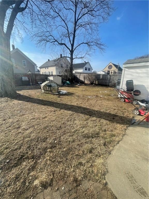 view of yard with a fenced backyard