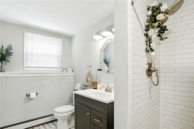 full bath with a baseboard radiator, a tile shower, vanity, and toilet