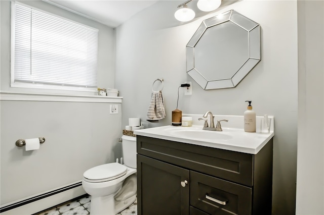 bathroom featuring a baseboard radiator, vanity, and toilet