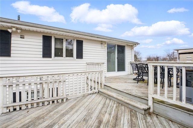 wooden deck featuring outdoor dining area