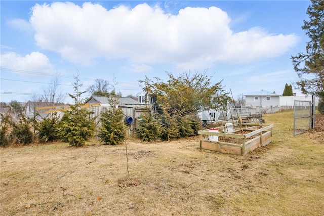 view of yard with a garden and fence