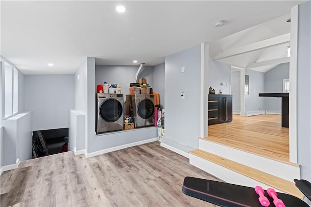 washroom featuring laundry area, baseboards, wood finished floors, washing machine and dryer, and recessed lighting