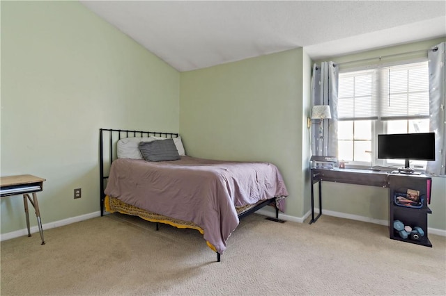 bedroom featuring lofted ceiling, carpet, and baseboards