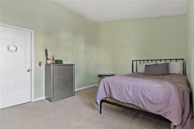 bedroom with carpet floors and baseboards