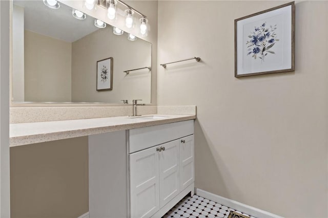 bathroom featuring vanity and baseboards