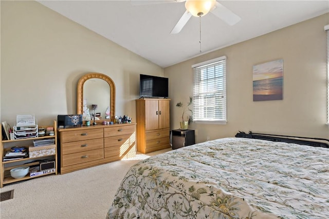 bedroom with lofted ceiling, carpet, and a ceiling fan