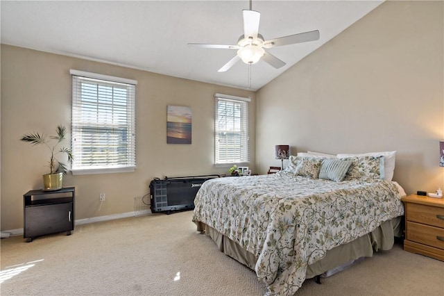 carpeted bedroom featuring a ceiling fan, vaulted ceiling, and baseboards