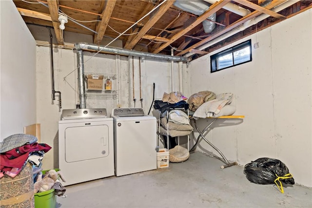 below grade area featuring washer and clothes dryer