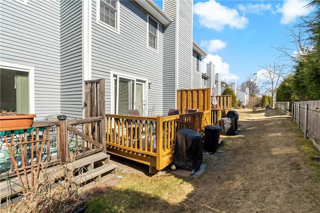 view of yard featuring a deck and fence