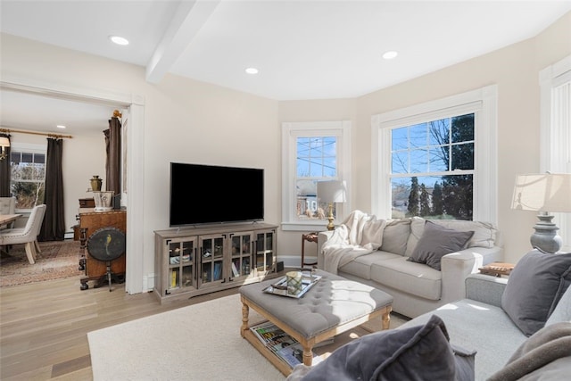 living room featuring baseboards, beamed ceiling, wood finished floors, and recessed lighting