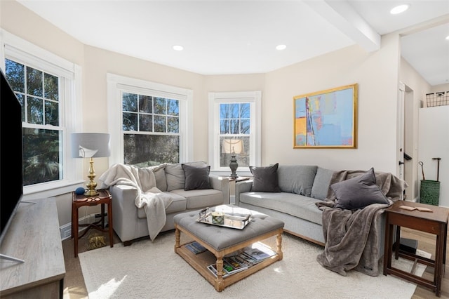 living area featuring wood finished floors, beam ceiling, and recessed lighting