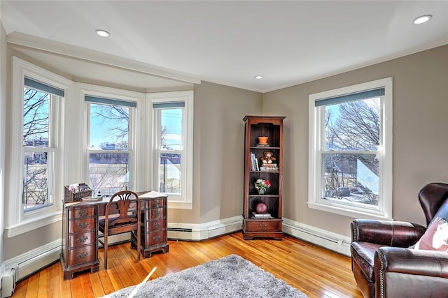 office with light wood-type flooring and a baseboard radiator