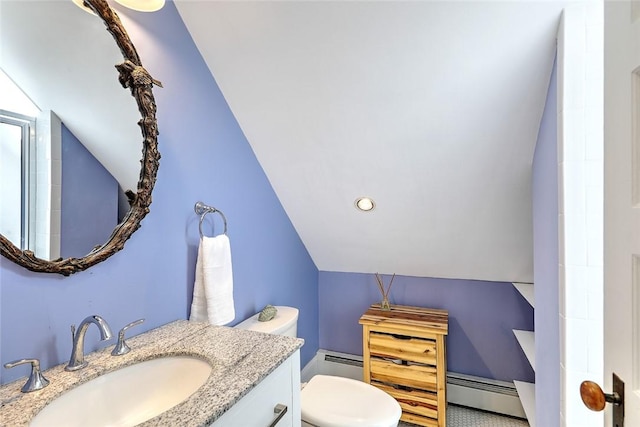 bathroom featuring a baseboard radiator, toilet, a baseboard heating unit, vanity, and vaulted ceiling