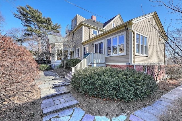 view of property exterior with brick siding