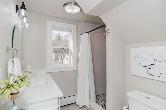 full bathroom with toilet, a stall shower, baseboard heating, and a sink