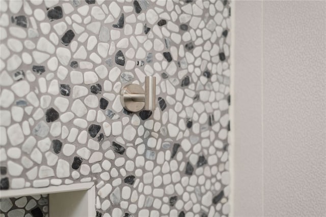 room details featuring a tile shower