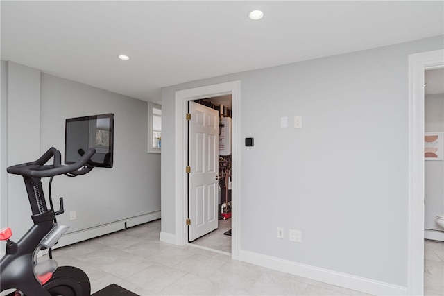 exercise area featuring recessed lighting, baseboards, and baseboard heating