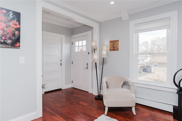 foyer featuring baseboards, wood finished floors, crown molding, a baseboard heating unit, and recessed lighting