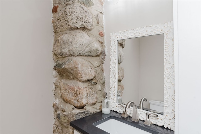 interior details featuring toilet and a sink