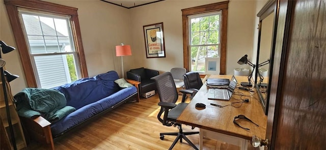 home office with light wood-style floors