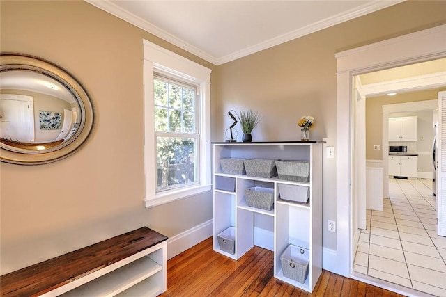 office area featuring baseboards, ornamental molding, and hardwood / wood-style floors