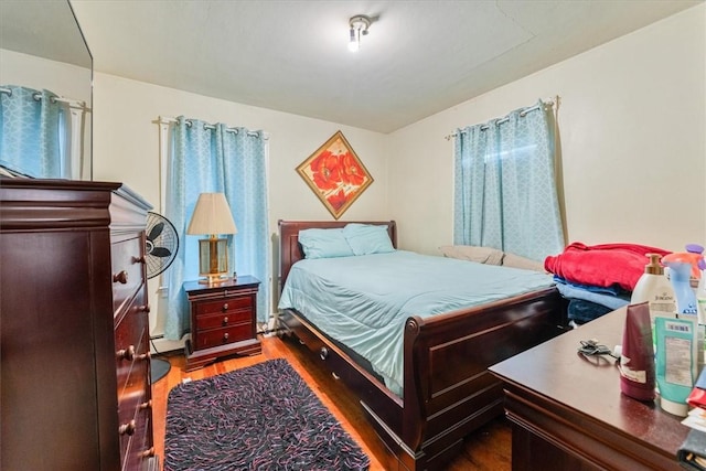 bedroom featuring wood finished floors