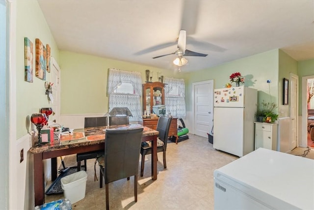 office with light floors and a ceiling fan