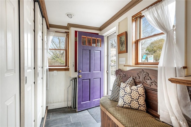 mudroom featuring crown molding