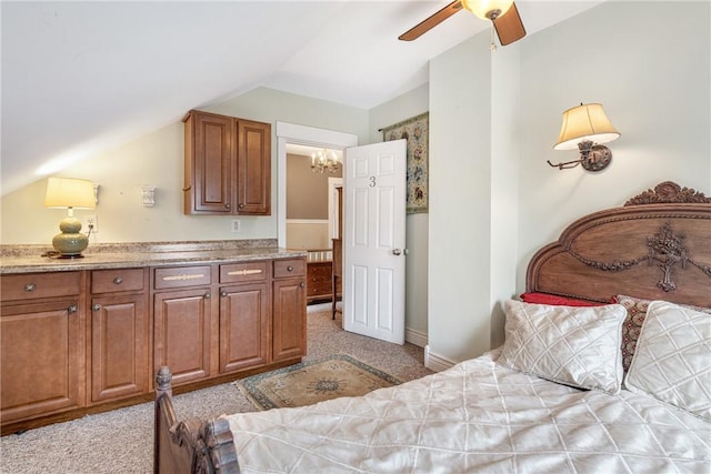 bedroom with light colored carpet, vaulted ceiling, and ceiling fan