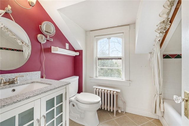 full bathroom featuring toilet, radiator heating unit, tile patterned flooring, shower / bath combo with shower curtain, and vanity