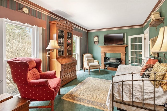 sitting room featuring carpet floors, a fireplace, and crown molding