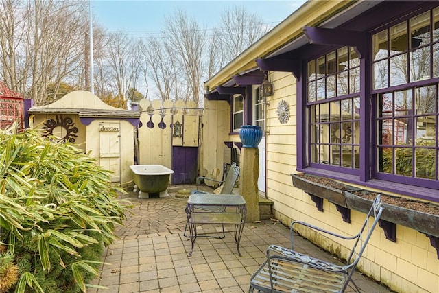 view of patio / terrace featuring fence