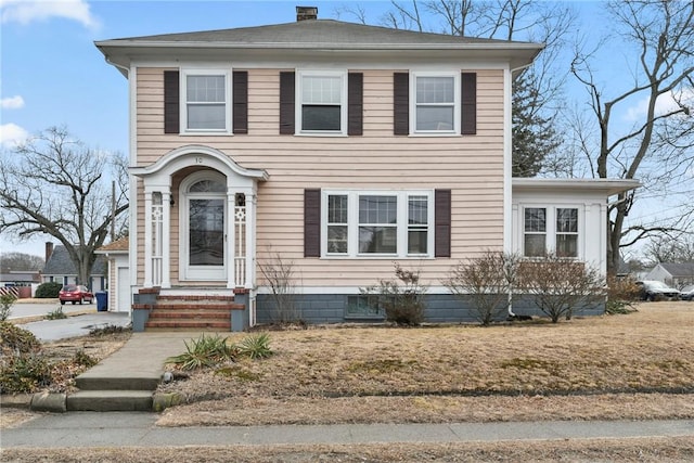 view of front of property featuring a chimney