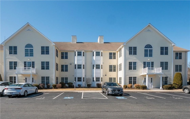 view of building exterior featuring uncovered parking